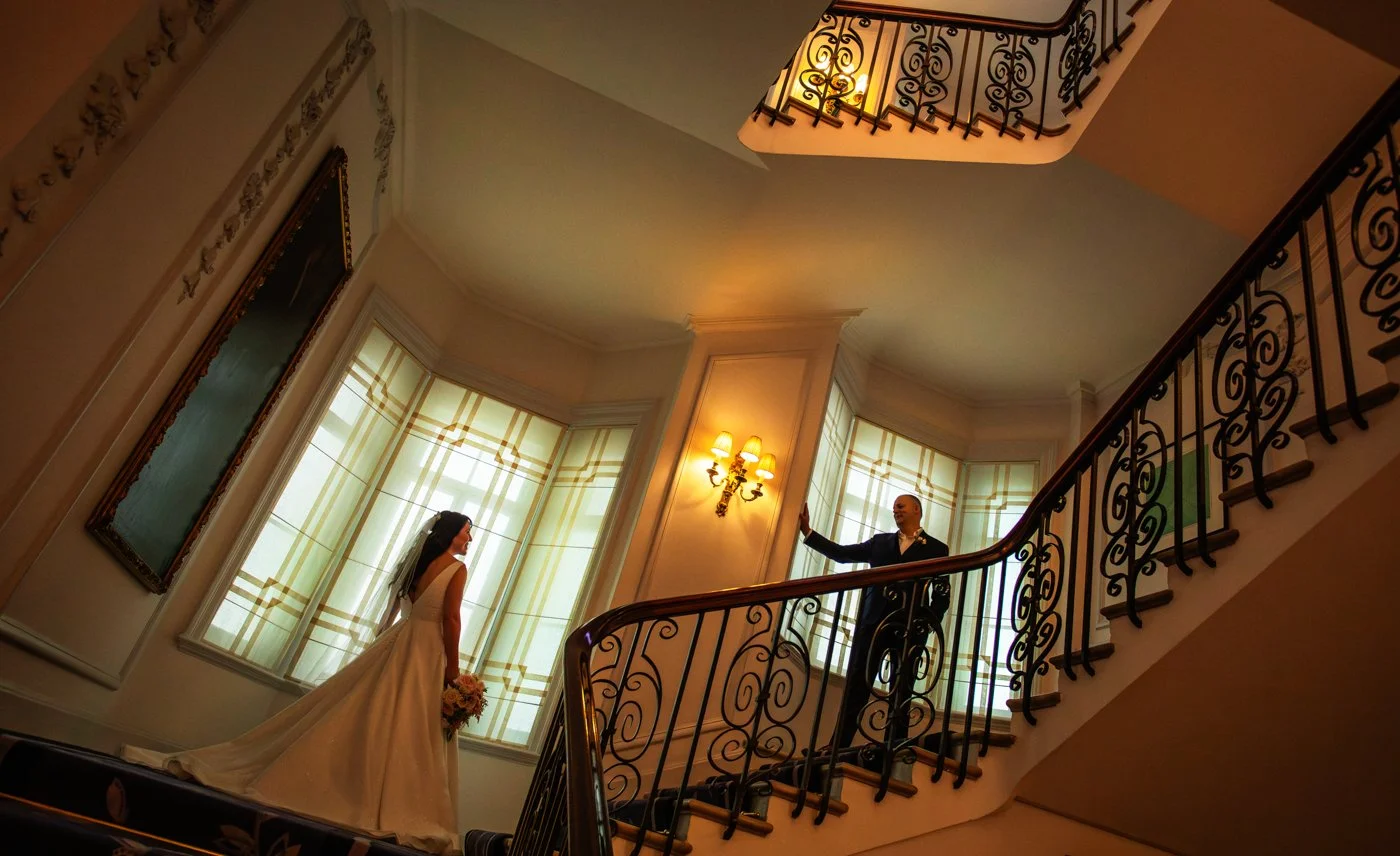 wedding-photograph-claridges-staircase-couple-symmetry.jpg