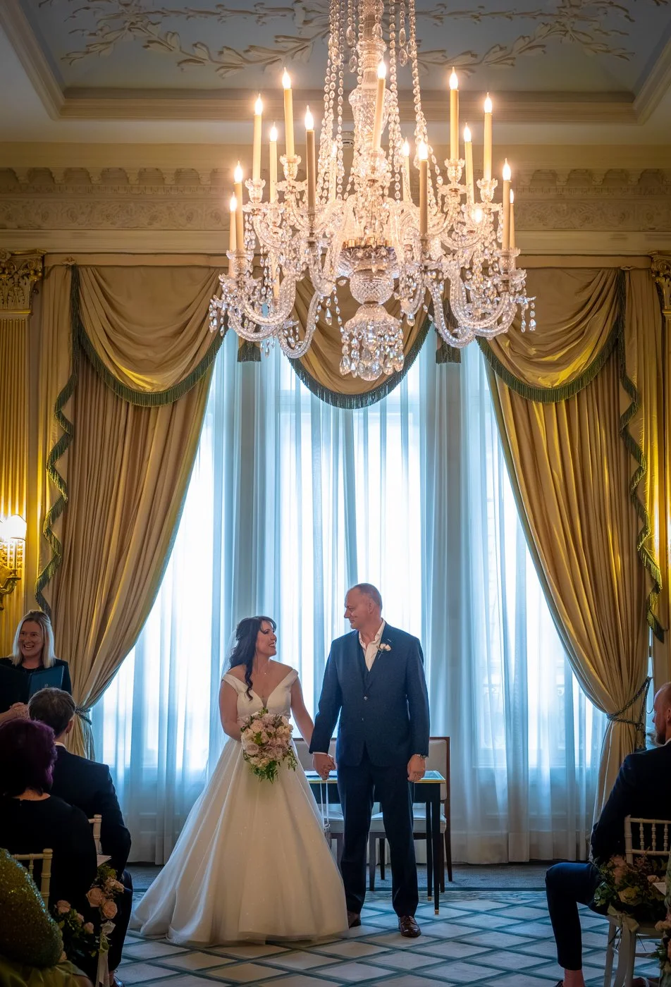 wedding-photograph-claridges-married-couple-chandelier-ceremony.jpg