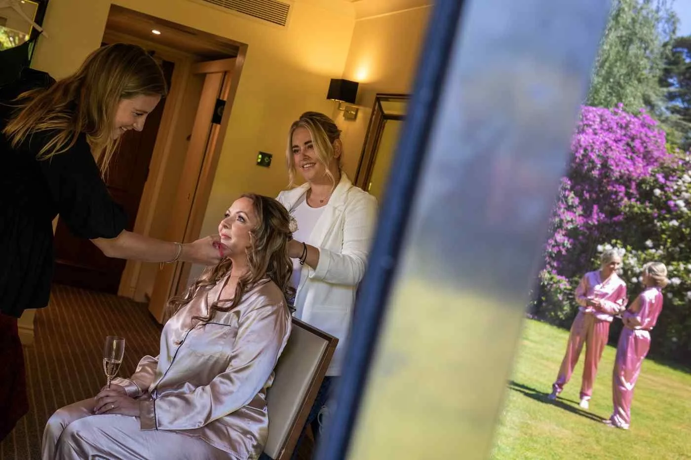 bride getting ready for wedding day in makeup chair