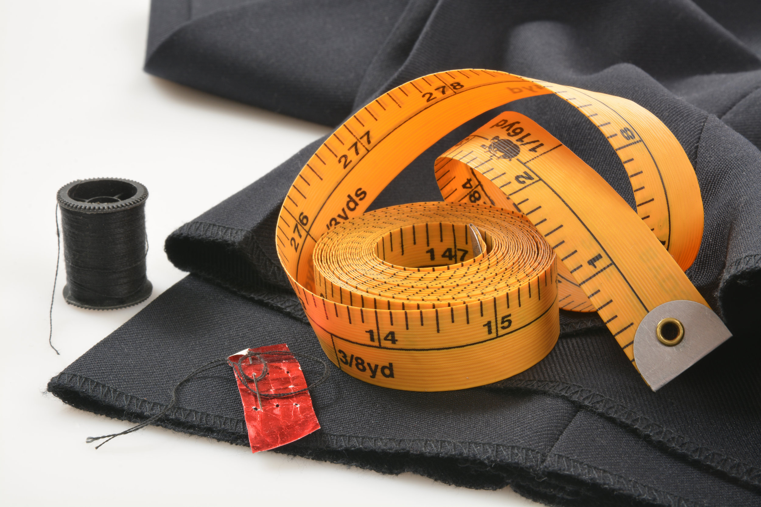 measuring tape on trouser