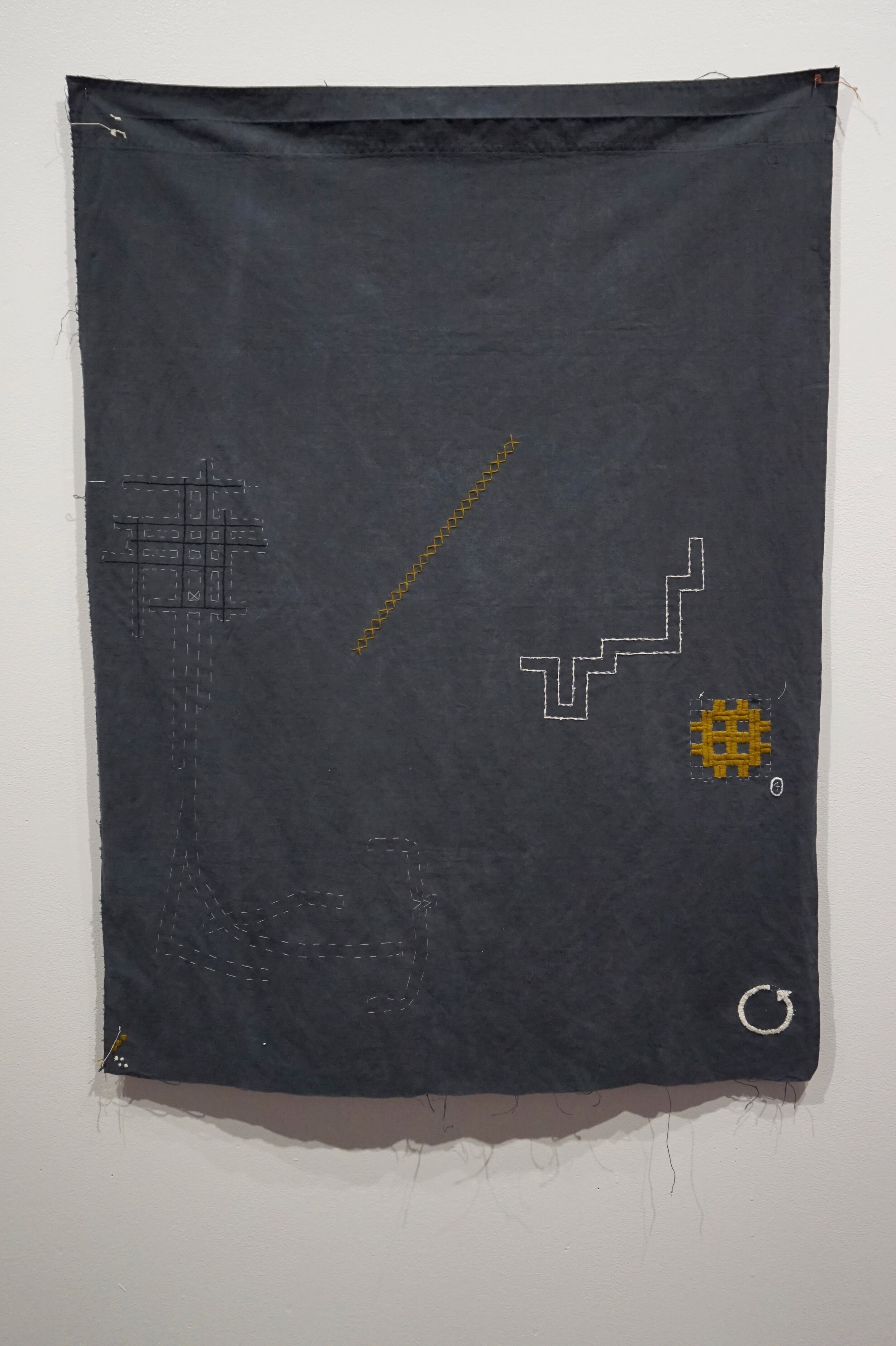 Language, 2019, Embroidery thread on found fabric, 32" x 43"