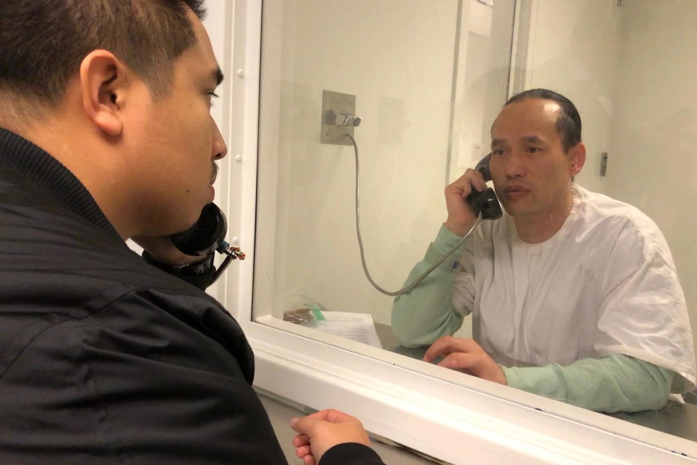 Nathaniel Tan visiting Borey "Peejay" Ai while in ICE custody in Winter 2017.