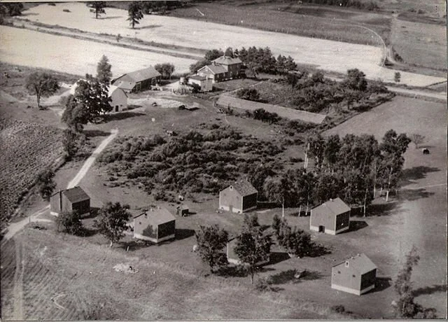 Our next throwback photo is from the Dunes before it was the Dunes. The first photo is taken in 1953 of the tobacco farm. Notice there is no pond in the photo. The second photo is older and taken when the barn that is our current service shop was bei