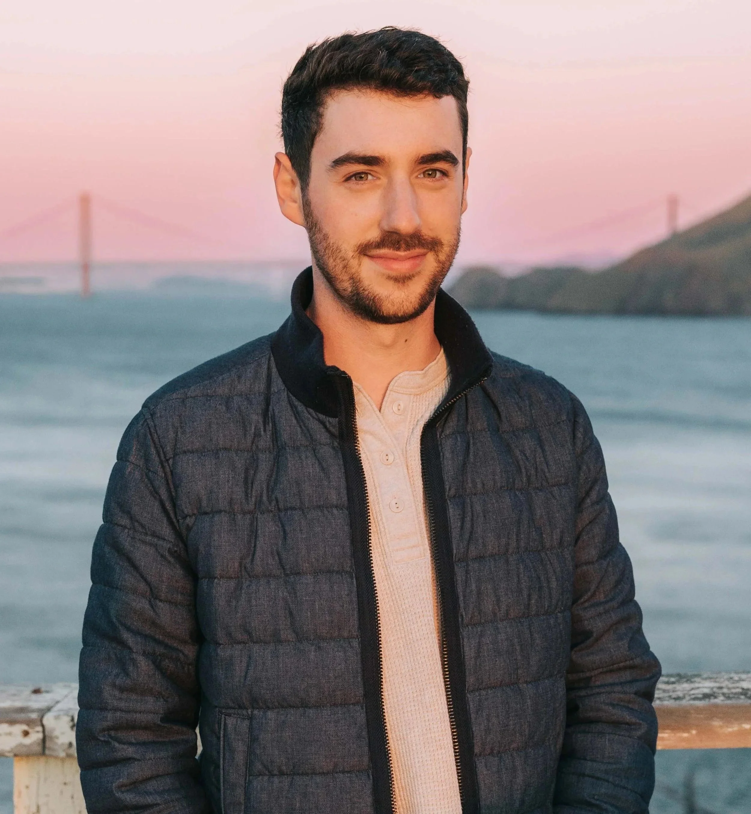 Cole Keister Headshot at sunset in front of the Golden Gate Bridge.