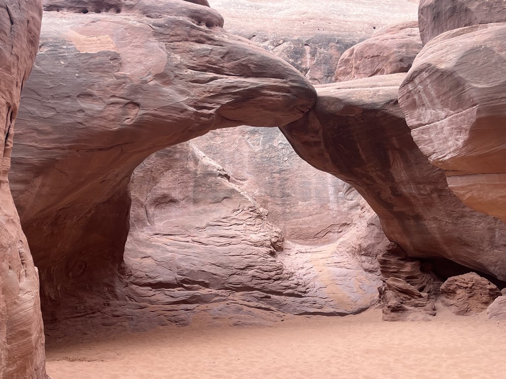 And there it is surrounded by soft red sand! Sand Arch!