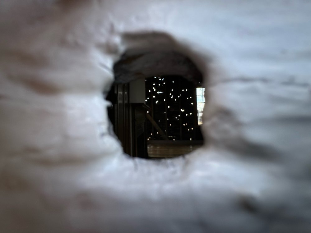 Looking into the office through a bullet hole...