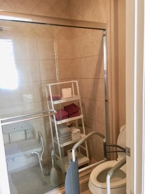 Before: Our client was unable to safely use her shower area. We removed the glass and the dam and created a fully accessible shower and made the space a wet room.