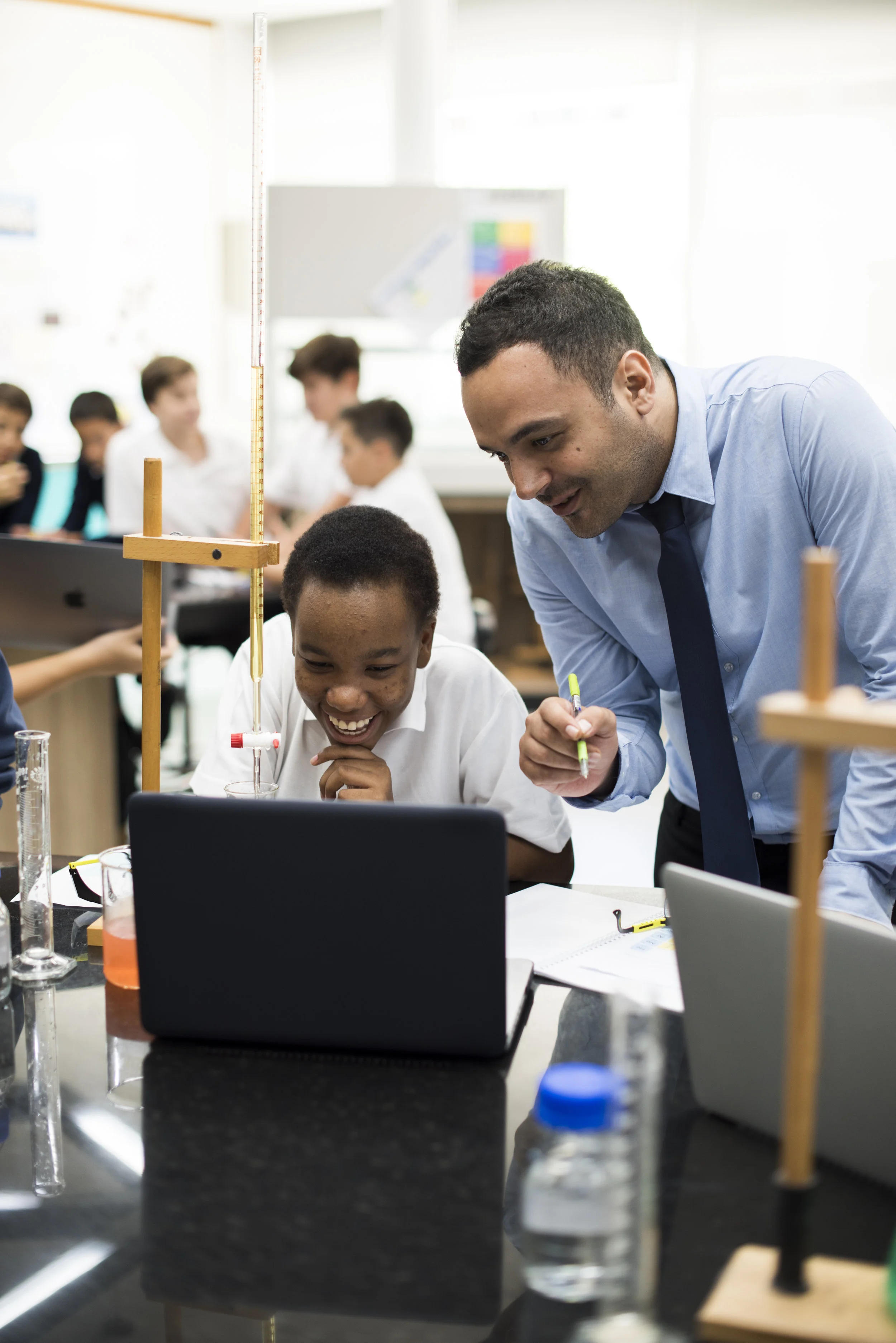 shutterstock_654480115_kid_smiling_w_teacher.jpg