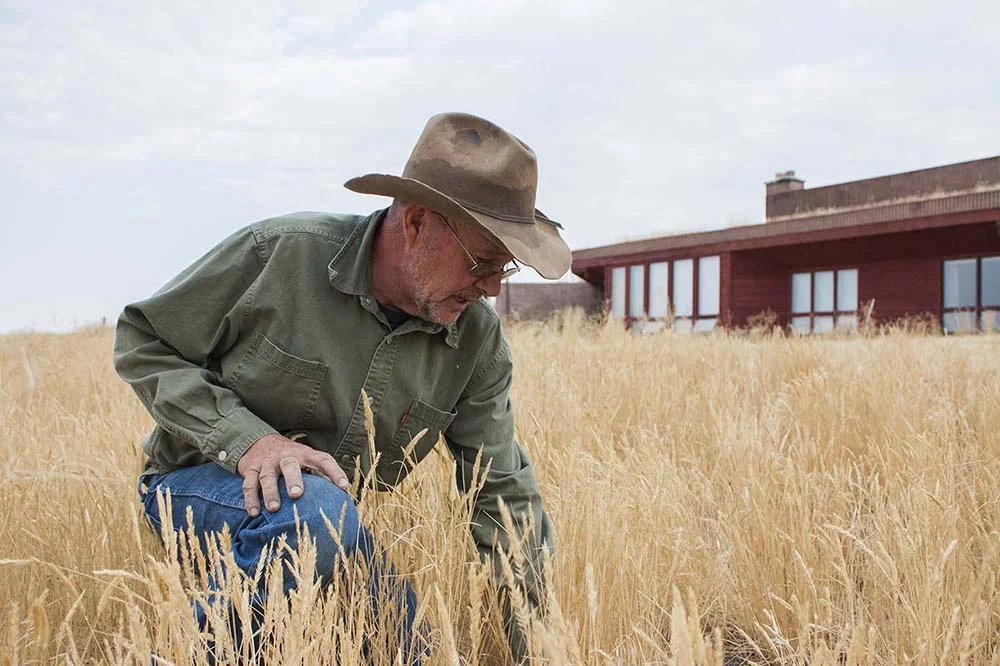 Steve in front of his solar powered home.