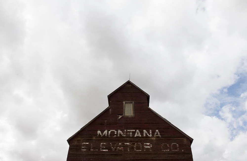 An abandoned grain elevator in downtown Grass Range, Montana.