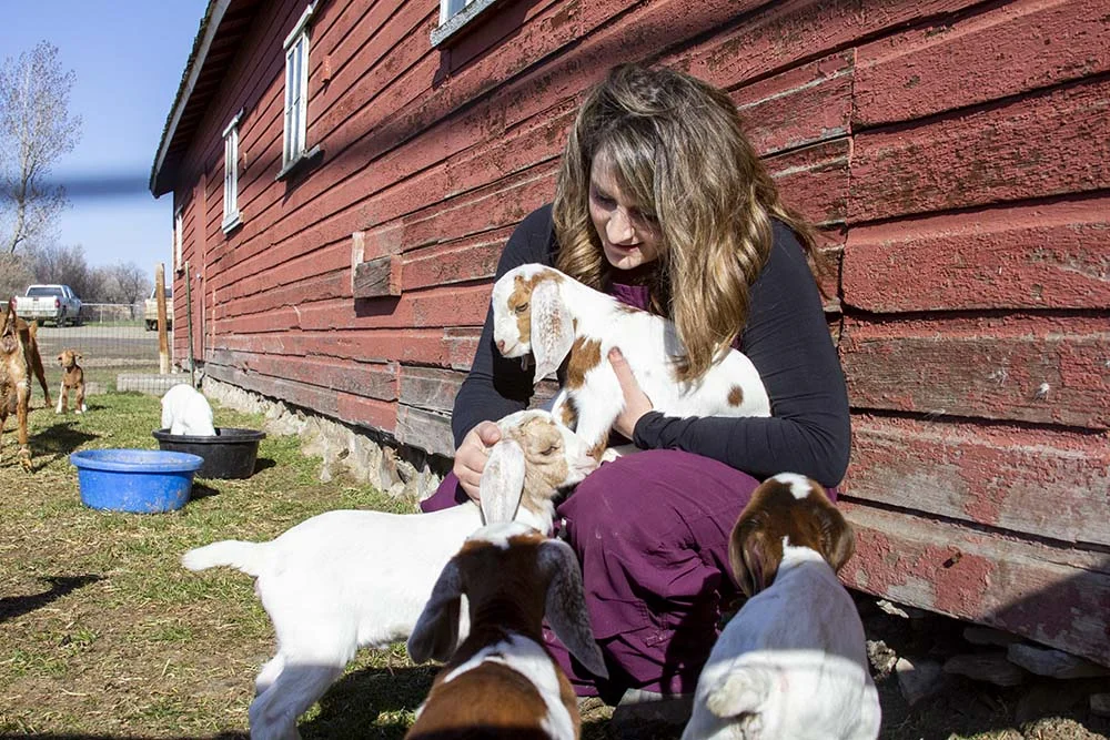 Sara with goats at her home in Molt, Montana.