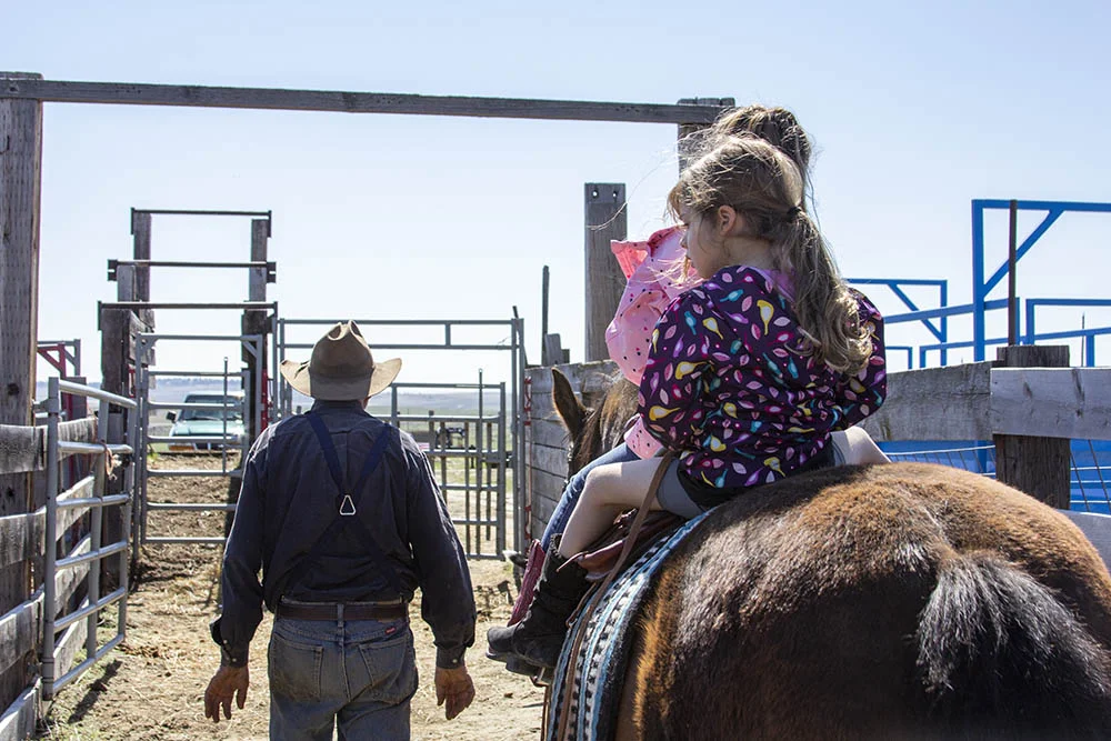   Steve Charter (left) leads his grandaughters Delilah and Stevie.  