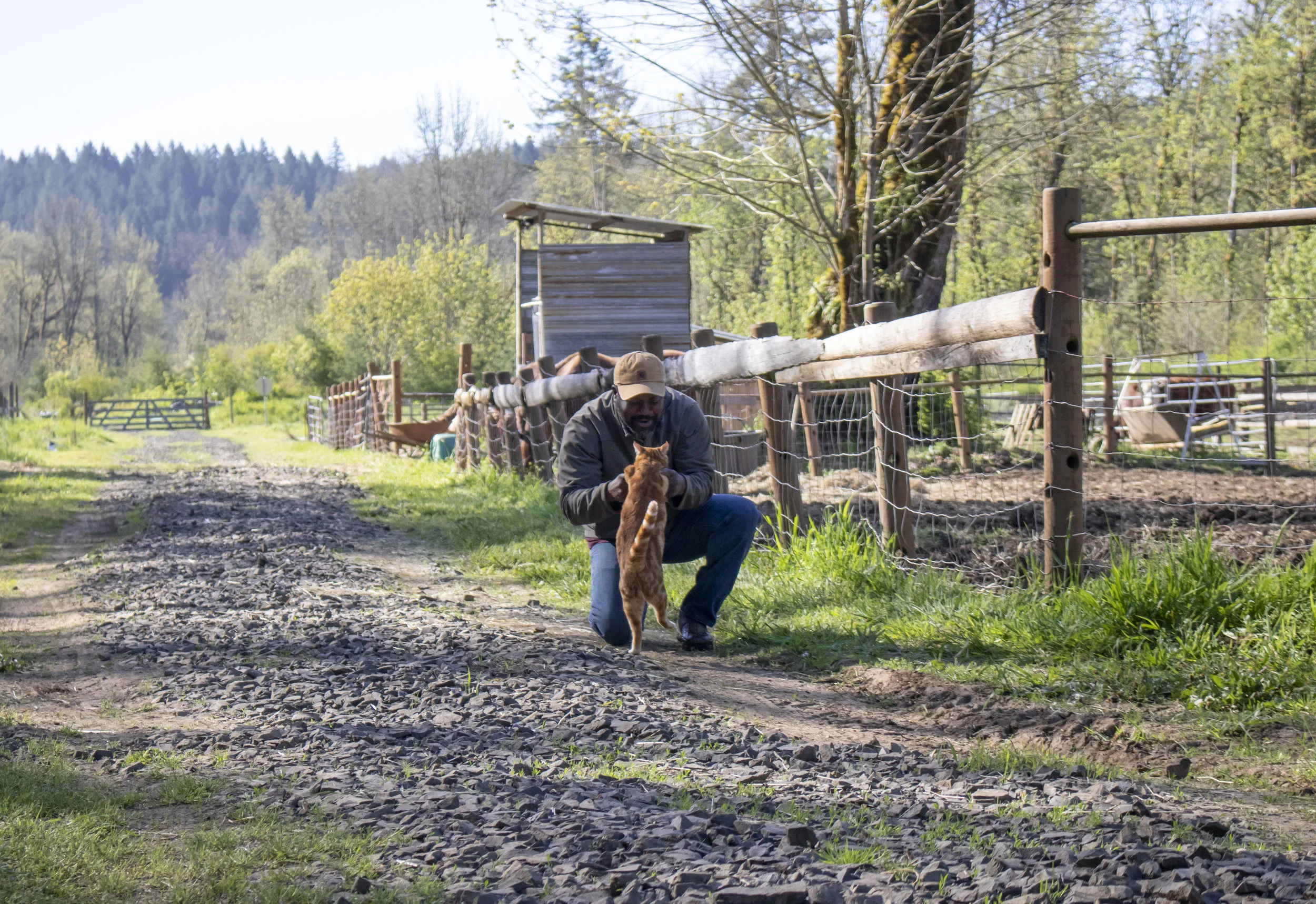   Rohn embraces his cat Glennelle.  