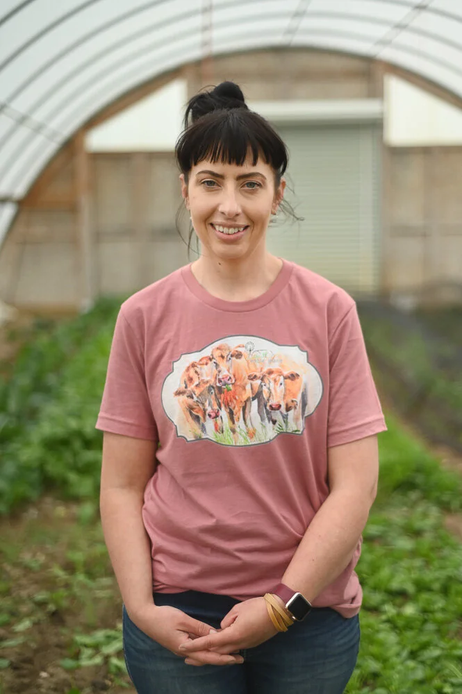 Erin Galloway poses for a portrait in the EPP greenhouse.