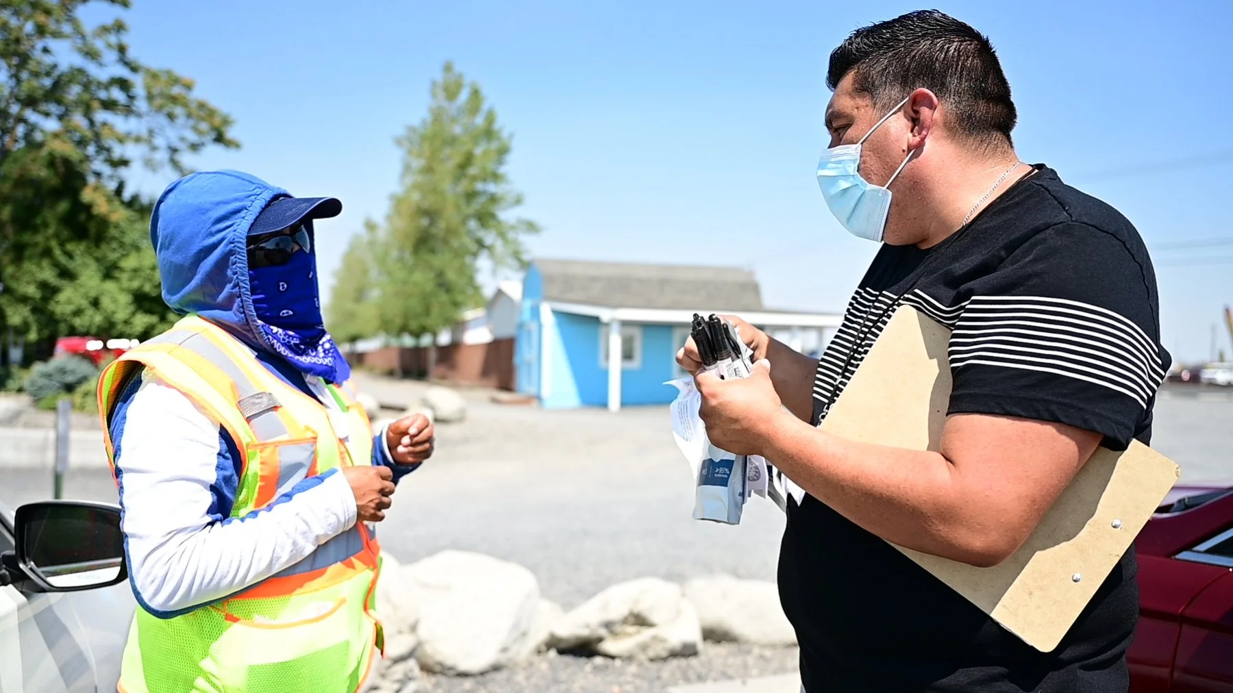  Rafael Ramero in the field handing out COVID PPE and talking with people about a vaccine event being held later that day.  