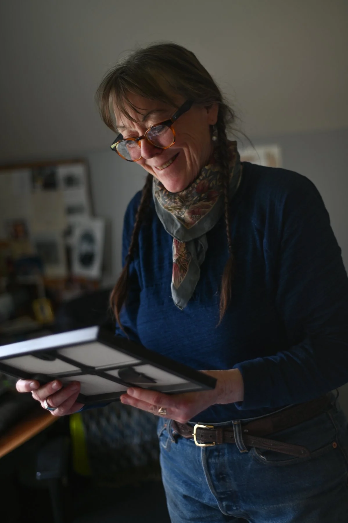 Jill smiles while looking at a letter from FERC saying the pump storage project was shut down.  