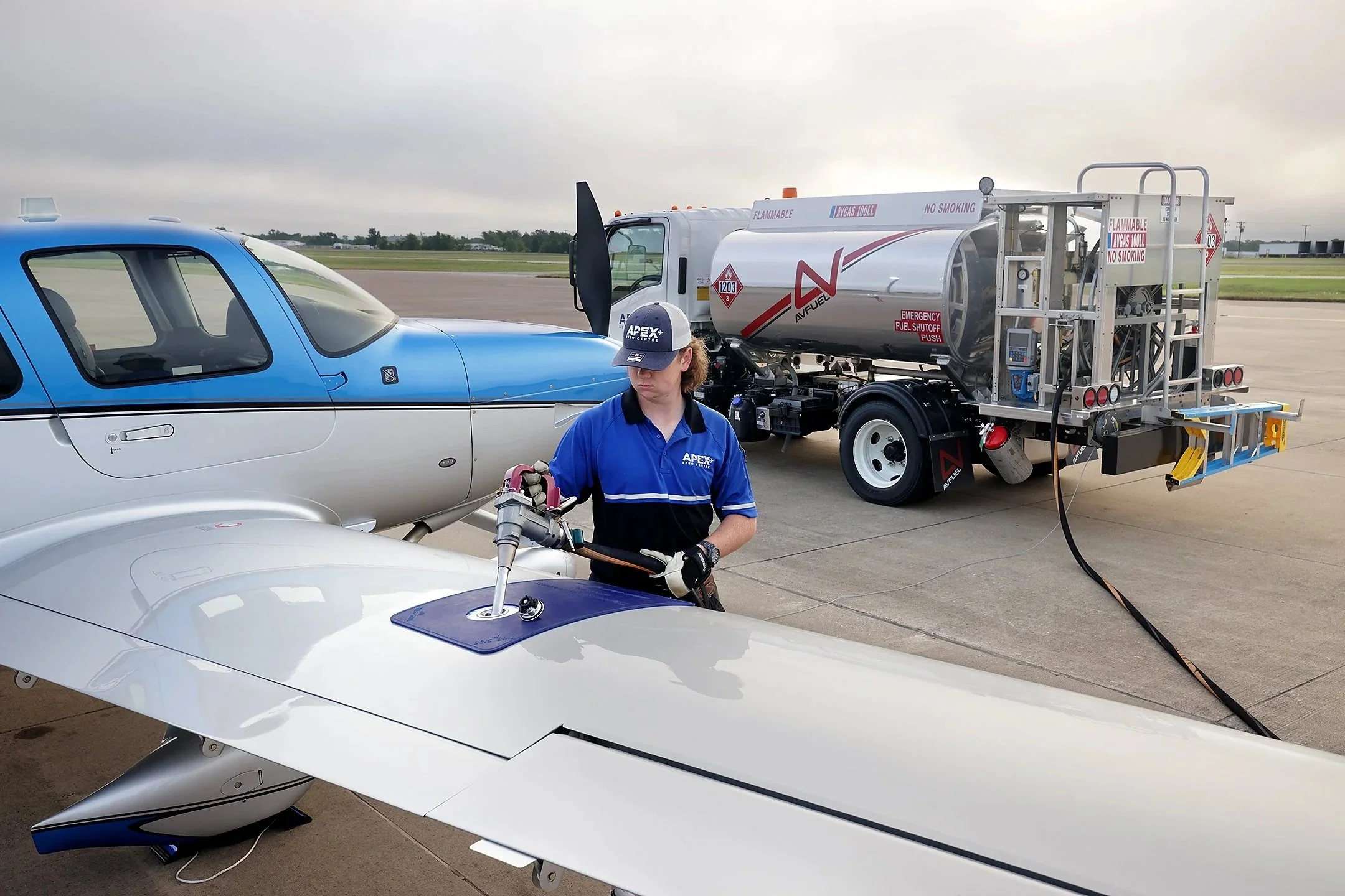 Apex Aero Center TRL line technician fueling a Cirrus SR22.