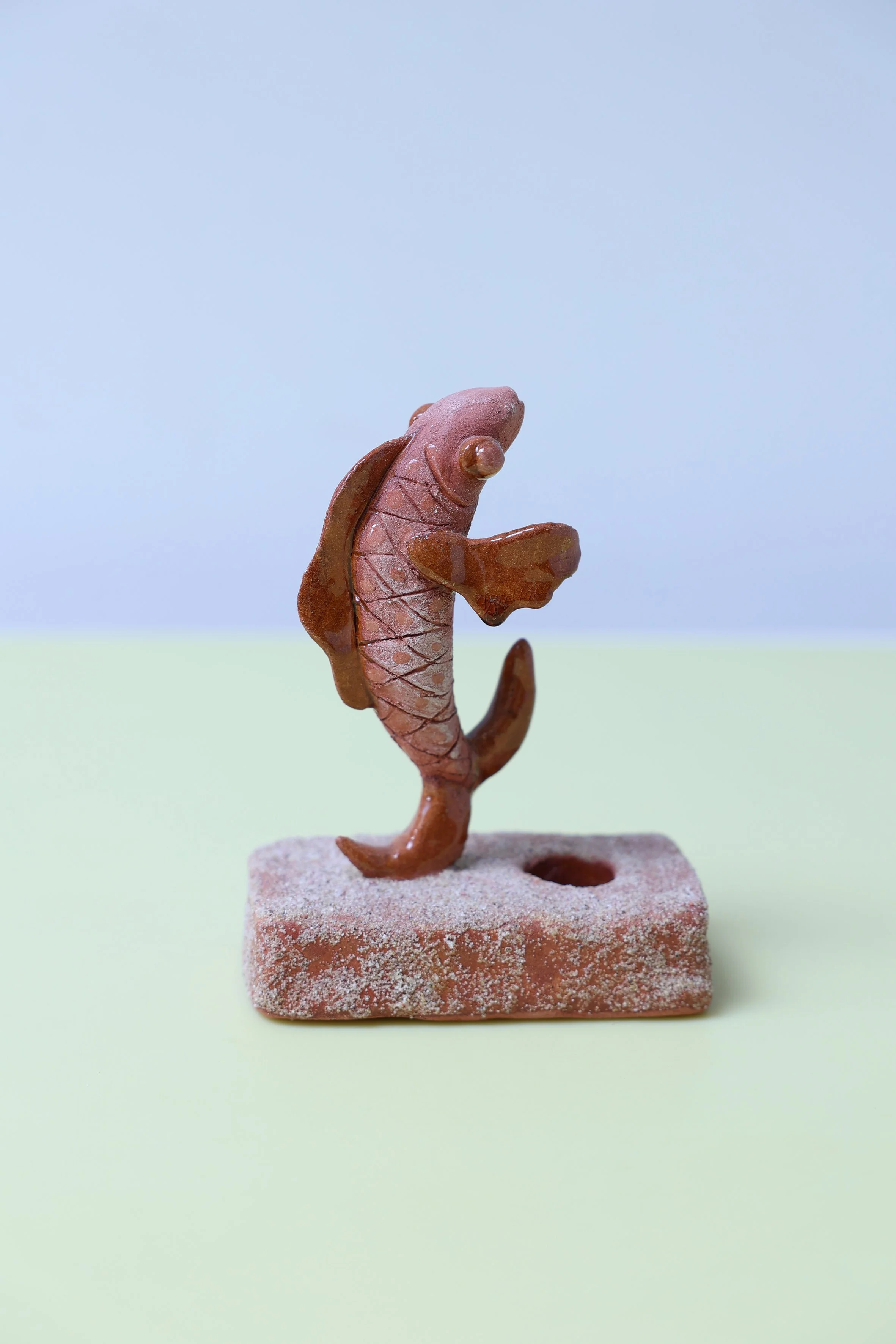 Dancing fish candle holder