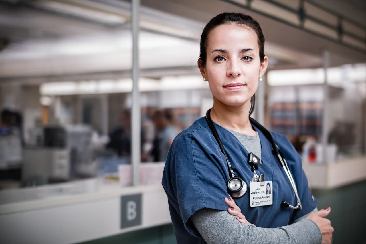 Confident-Female-Nurse-Portrait-at-Nursing-Station-X2.jpg