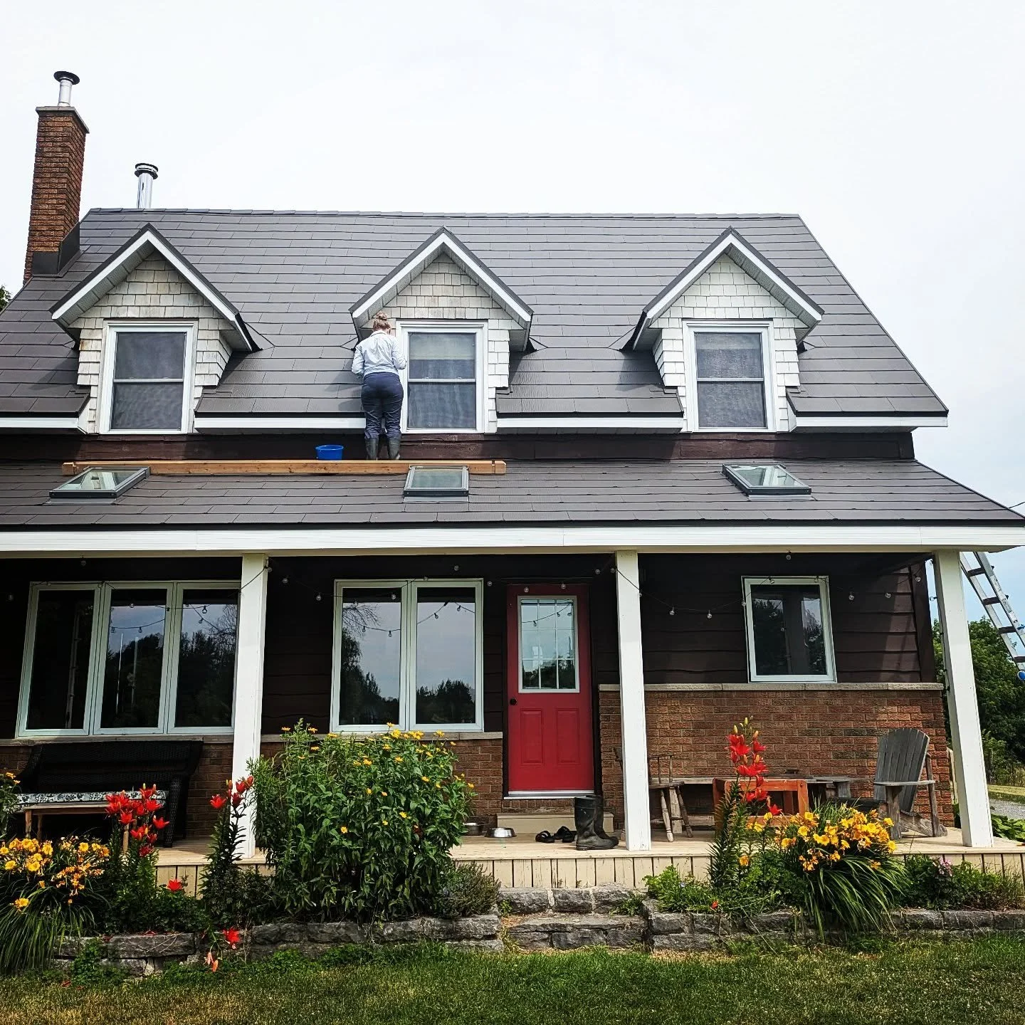 Painting the dormers. I really don't like heights but I do it anyways. Thanks to Ben for working on this with me. Yesterday was our 22nd anniversary and I am really grateful for him. It is nice to have this little project out of the way. #farmhouse #