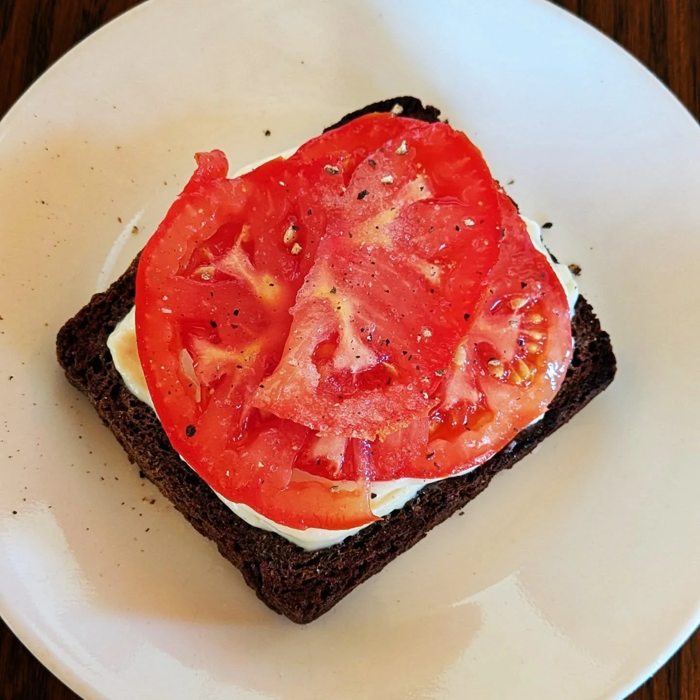 The taste of summer. Garden tomatoes on buckwheat toast. #gardentomatoes #cedarknollfinch @littlestreambakery