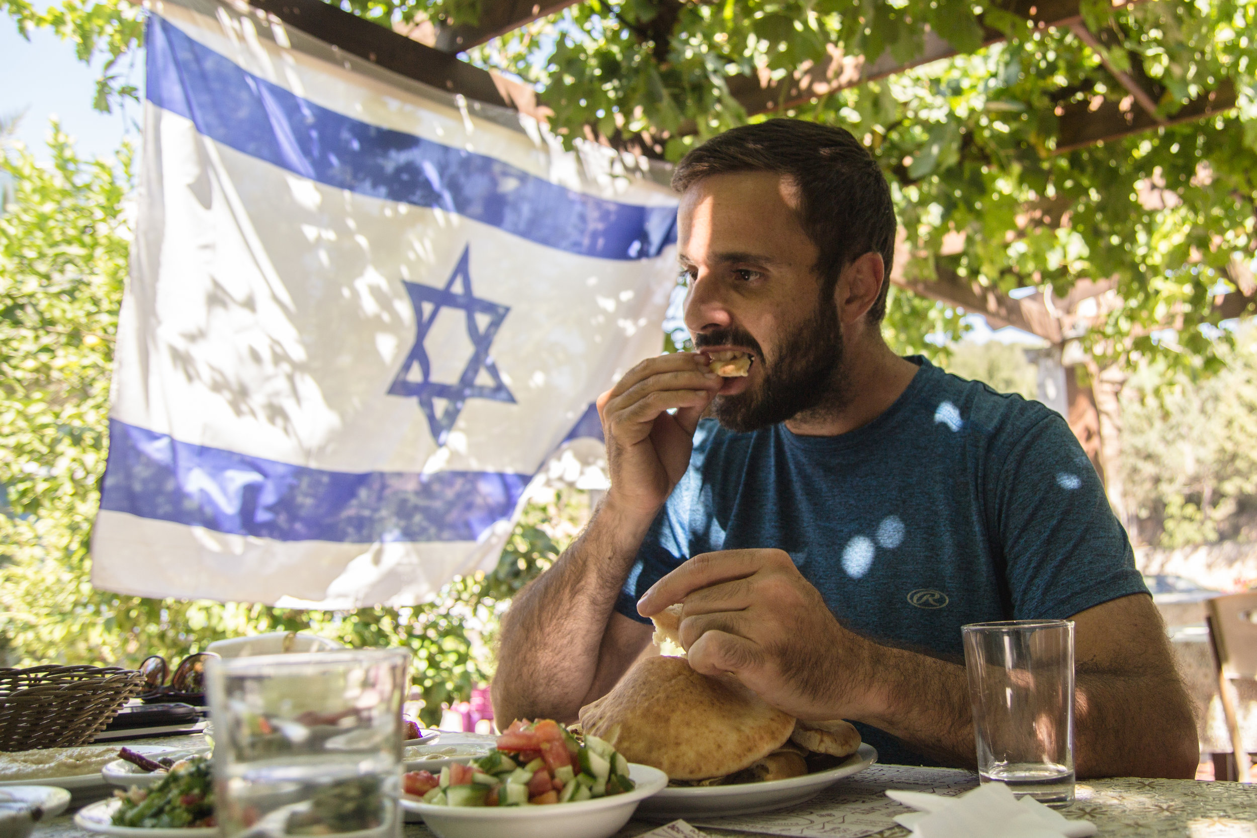 Roei enjoying pita - something that is just not the same in Canada