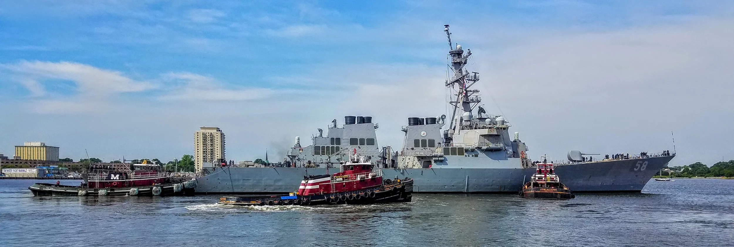 Leaving Norfolk for Cape Charles. War ship 58 being moved by my favorite tugs. Larry had to hail the War ship 58 to get permission from their captain to pass.