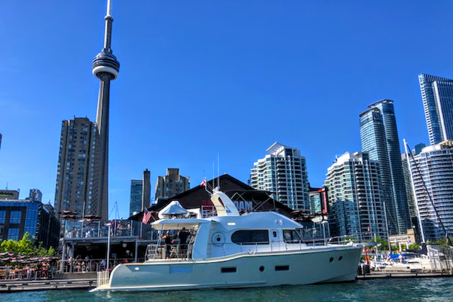 Thanks to dock master Maurice Landry, who took this great image of the Independence at her posh spot in front of the Toronto city skyline.