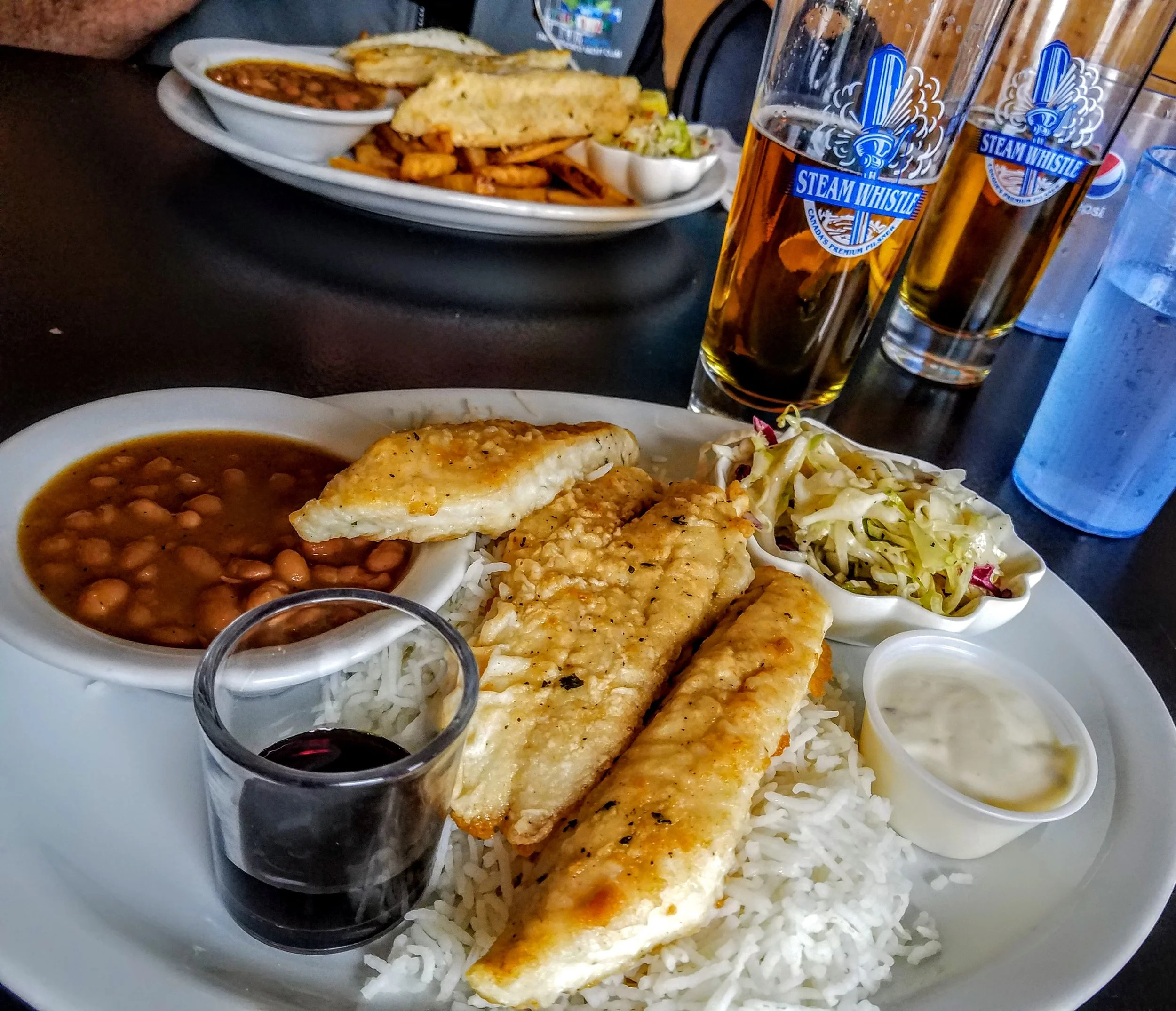 Pickerel with basmati rice and Steam Whistle Beer…we visited the brewery in Toronto