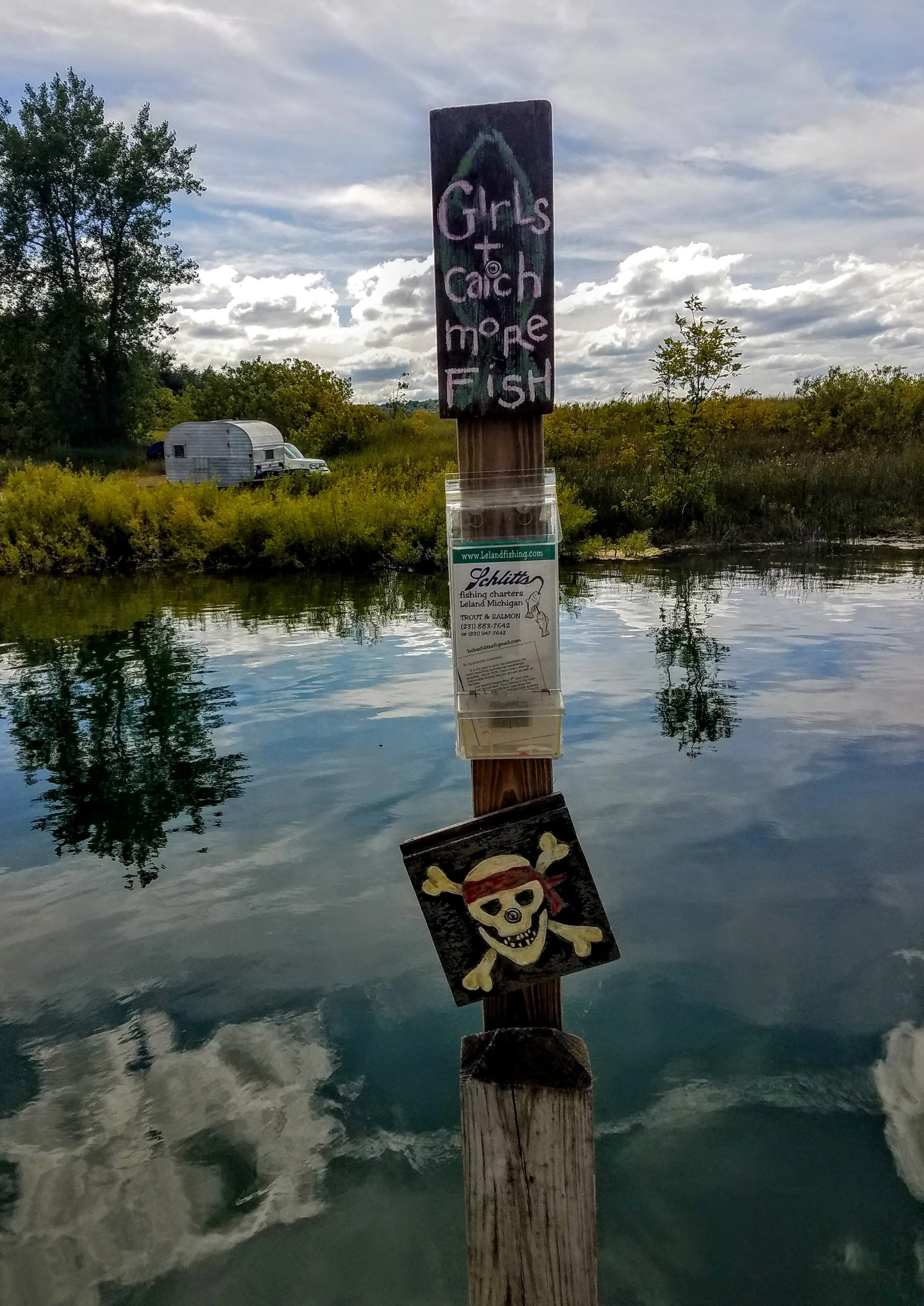 Schlitts Charters at Fishtown docks hope to catch Salmon, Steelhead, Brown, Lake Trout & Coho. Does that reflection of the cloud resemble a skeleton or is it just me…?