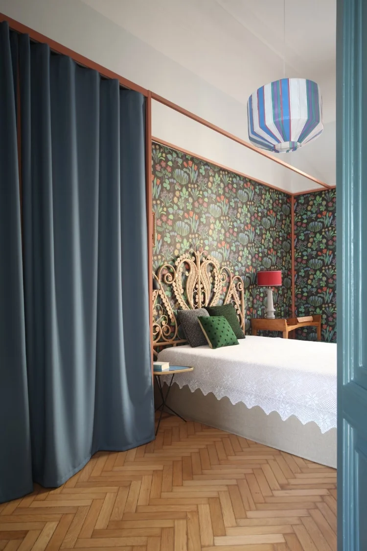 here-is-a-look-at-a-rattan-headboard-by-maison-du-monde-and-a-metallic-frame-wardrobe-designed-by-marcante-testa-with-a-curtain-by-kvadrat-the-suzie-pedant-lamp-is-by-colonel.jpg