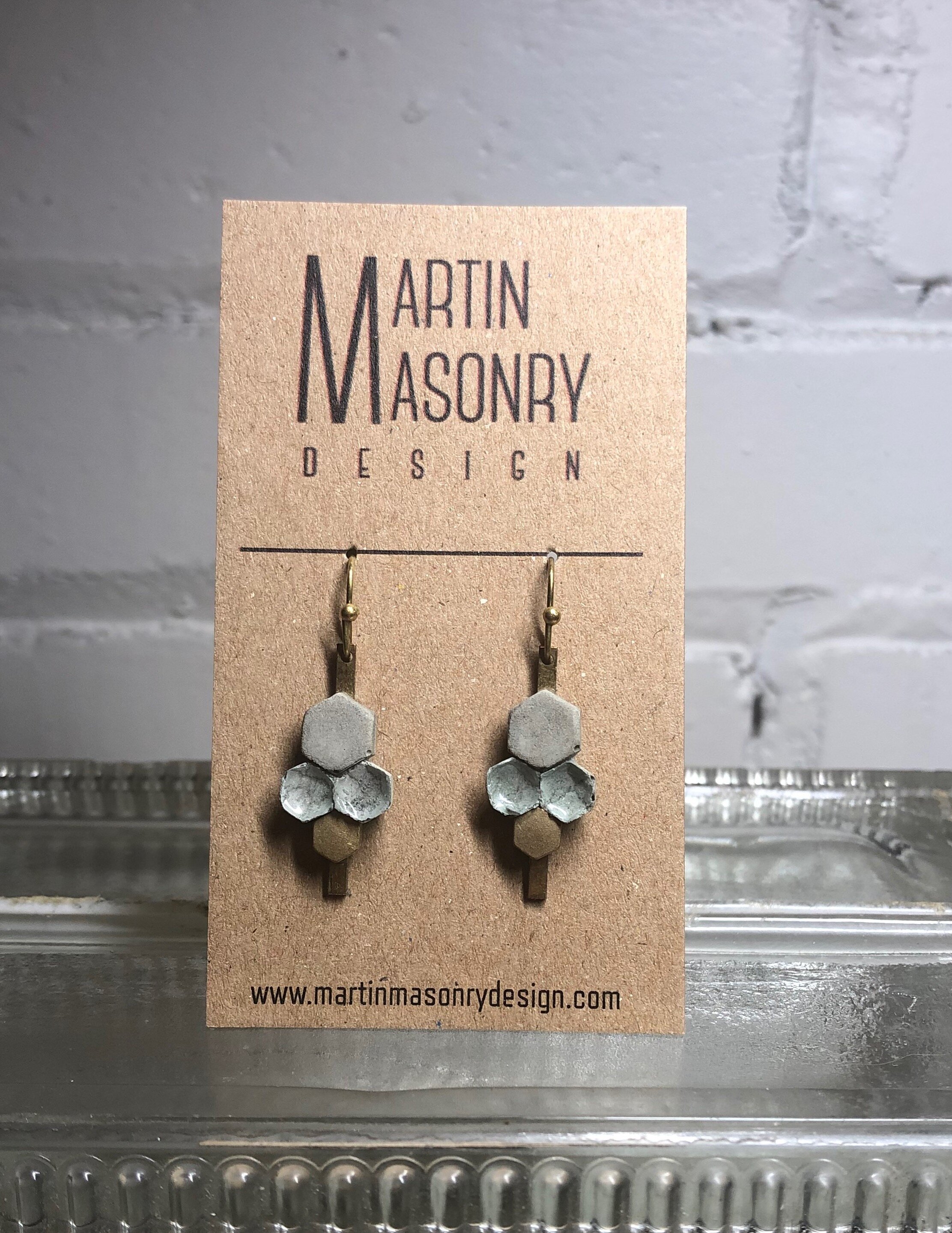 Cement, green grout and brass hexagon dangles