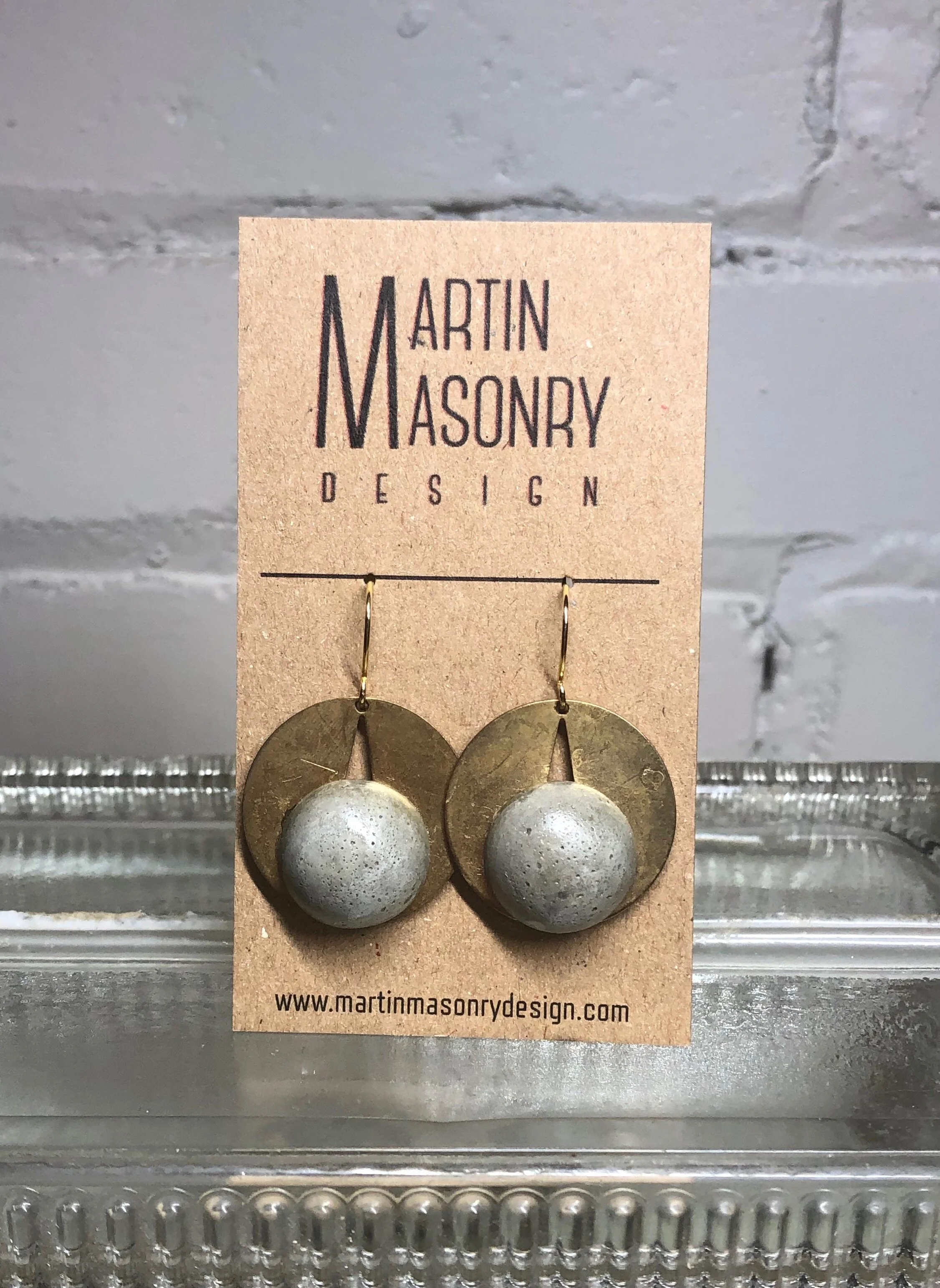 Cement orbs on brass A rings.jpeg