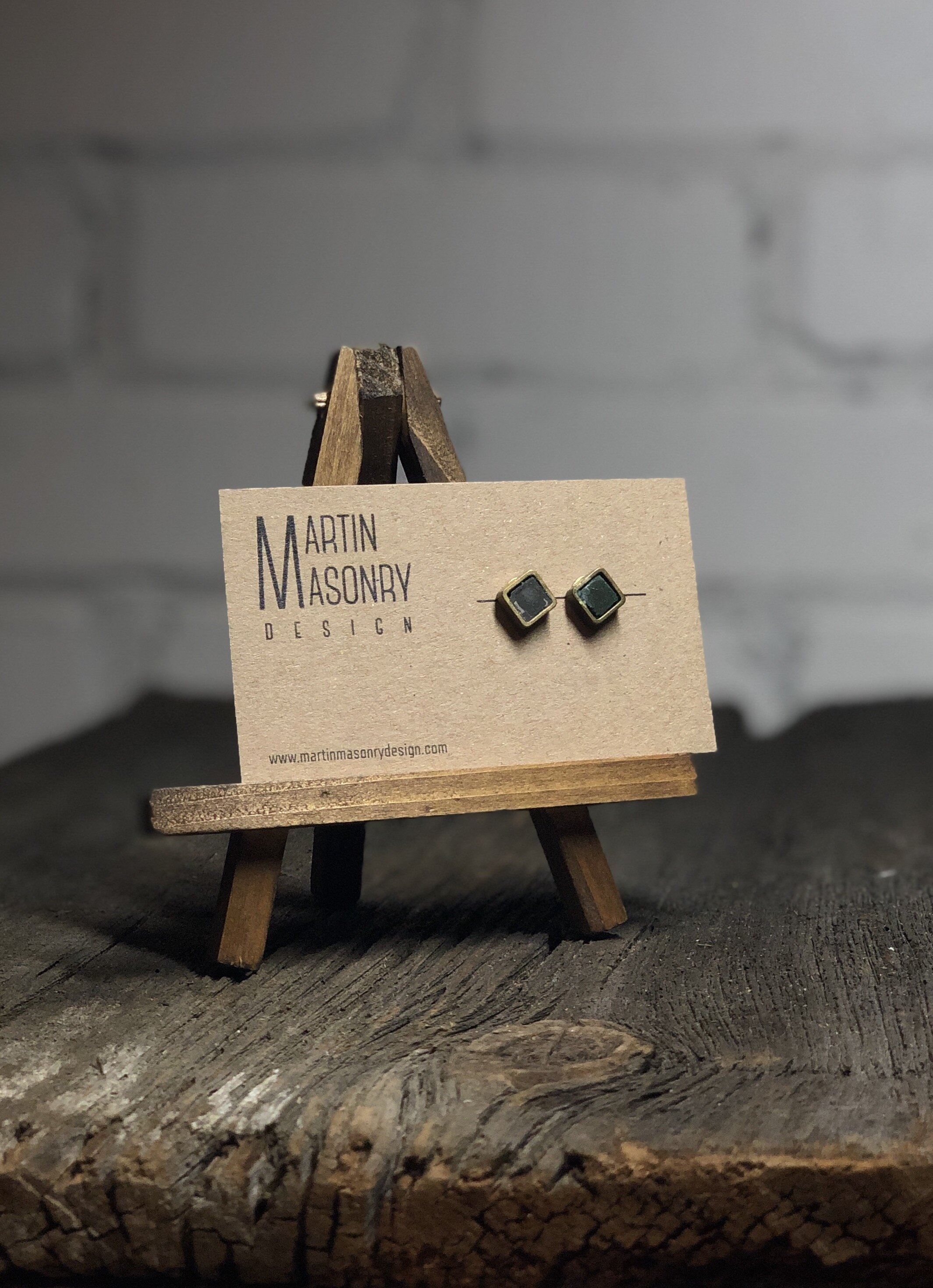 Charcoal grey grout cube posts with brass