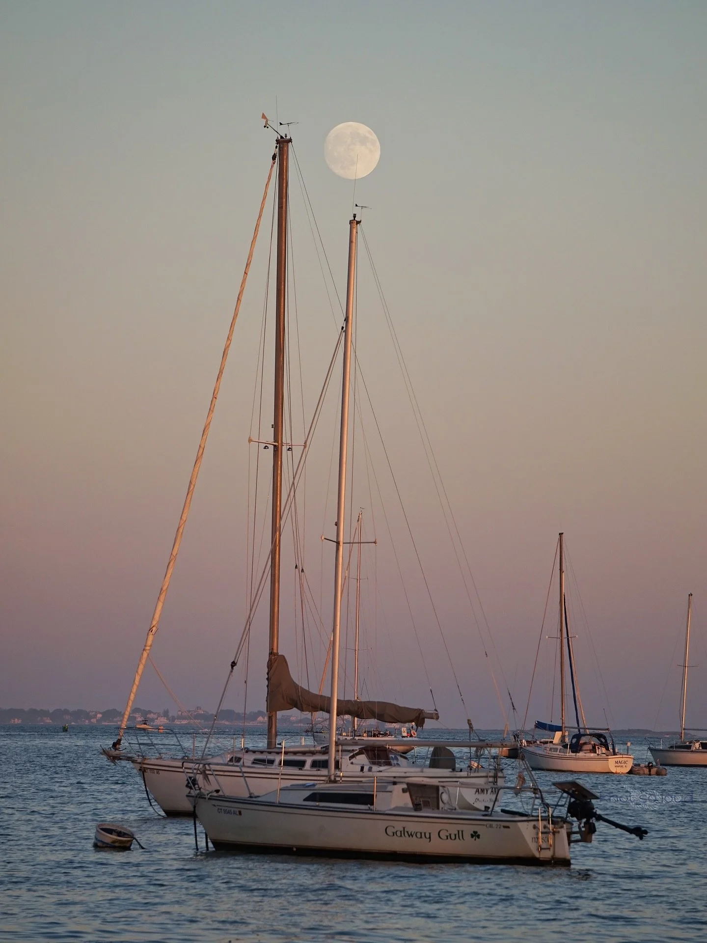 Just a bunch of sailboats moonlighting as models. ⛵️🌕 Almost full moon captured tonight 10/5 in Noank.