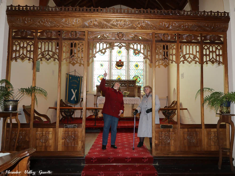 Pat Hobman, secretary of Parish Council and Shirley Hancox retired Parish Council member, both of Westbury, view the magnificent Nellie Payne carving ‘Seven Sisters Screen’. Nellie, one of nine daughters, carved this piece in memory of her 7 deceased sisters when she was 72. Installed in 1938, the screen is one of many significant carvings by Nellie located in the Anglican Church in Westbury. The church will hold an open day on the 21st July for people wanting to view the works.