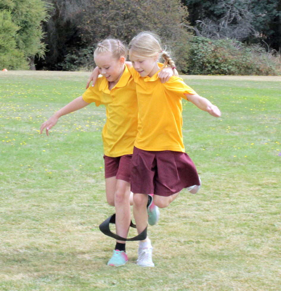 Isabella Sullivan-Taylor (8) and Katalina Wynn (9) competing in the 3 legged race at Bracknell Primary School Sports Carnival. Photo | Hayley Manning