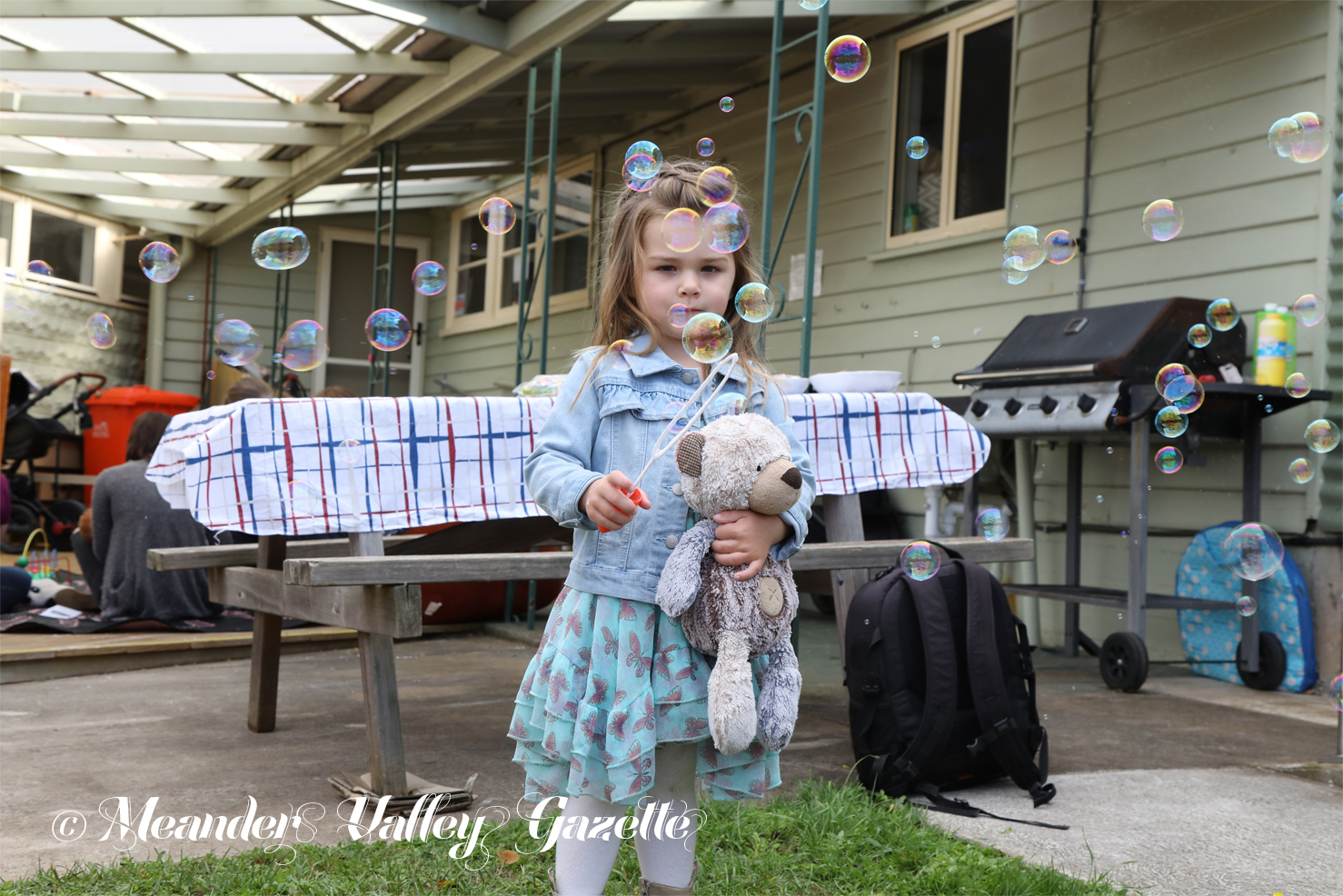 Three-year-old Lylah Ulbrich and her friend Ted, both from Biralee, are concentrating on getting that perfect bubble, at the Deloraine House Teddy Bears’ Picnic. Photo by Mike Moores