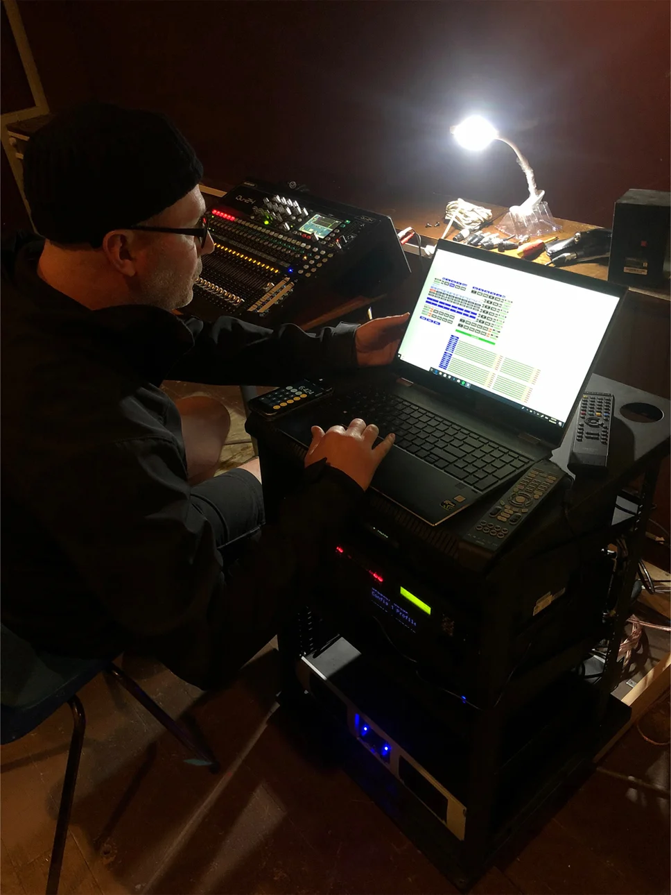A Sound House technician formatting the new sound system at the Little Theatre in Deloraine. Photo supplied