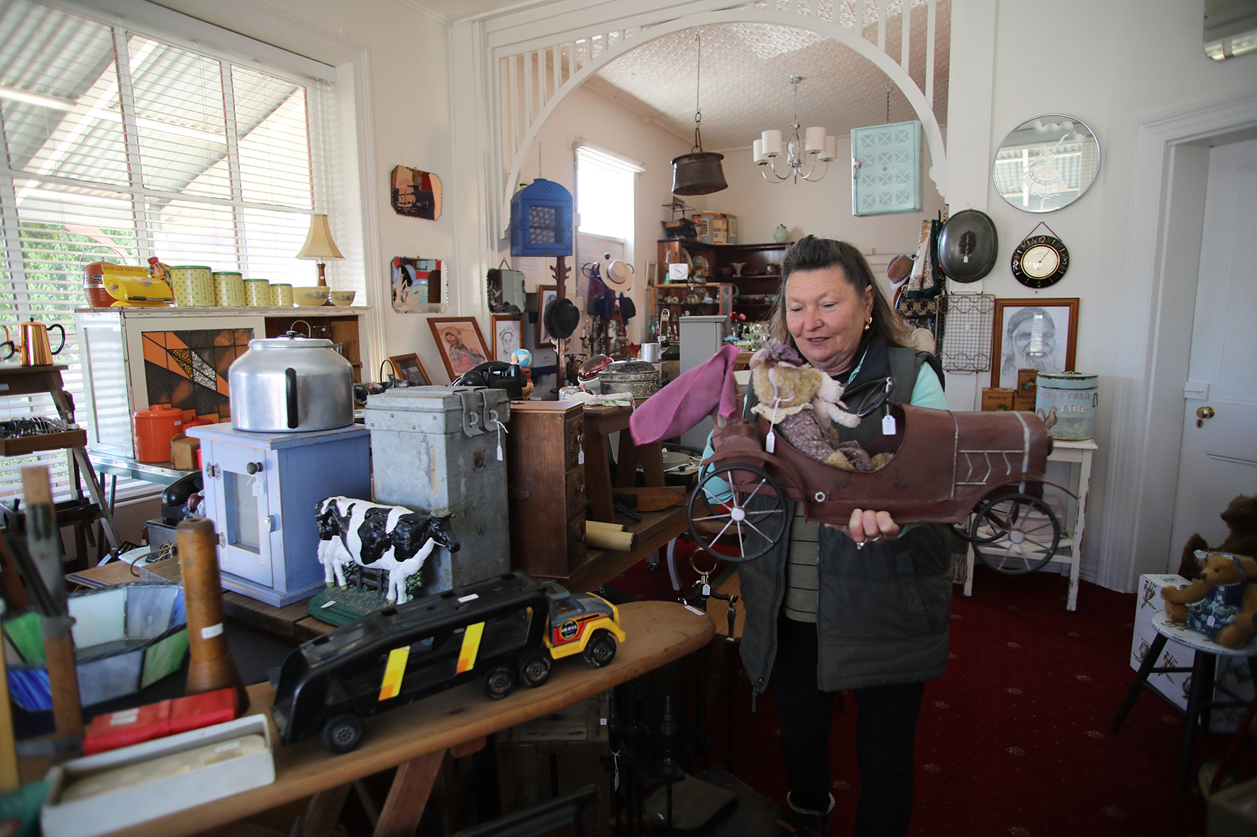 Eve Robson surrounded by a lifetime of collectables. Photo by Mike Moores