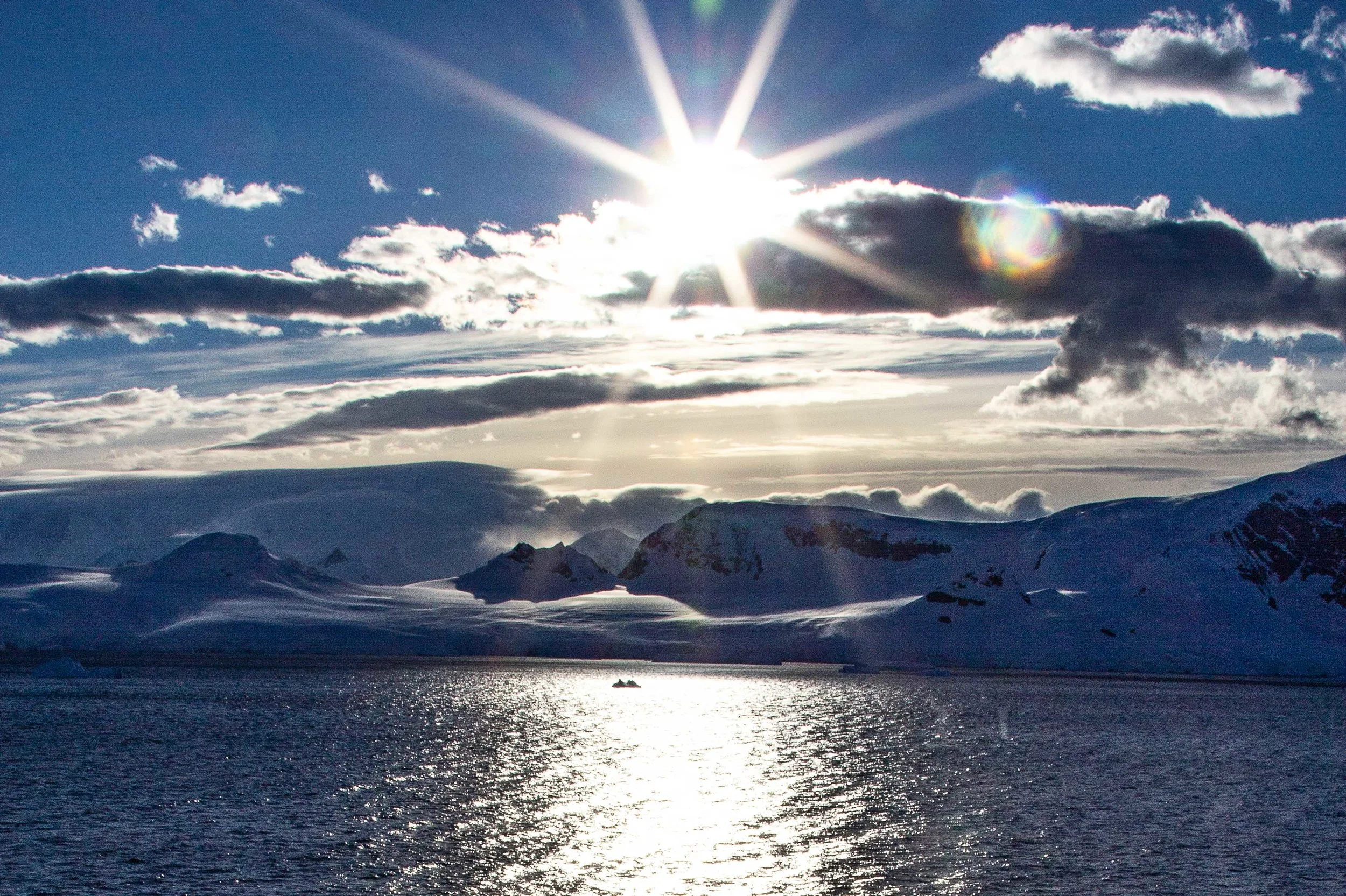 Sunrise in the Gerlache Strait. I rose early on this particular morning and watched numerous humpback whales feeding around the ship.