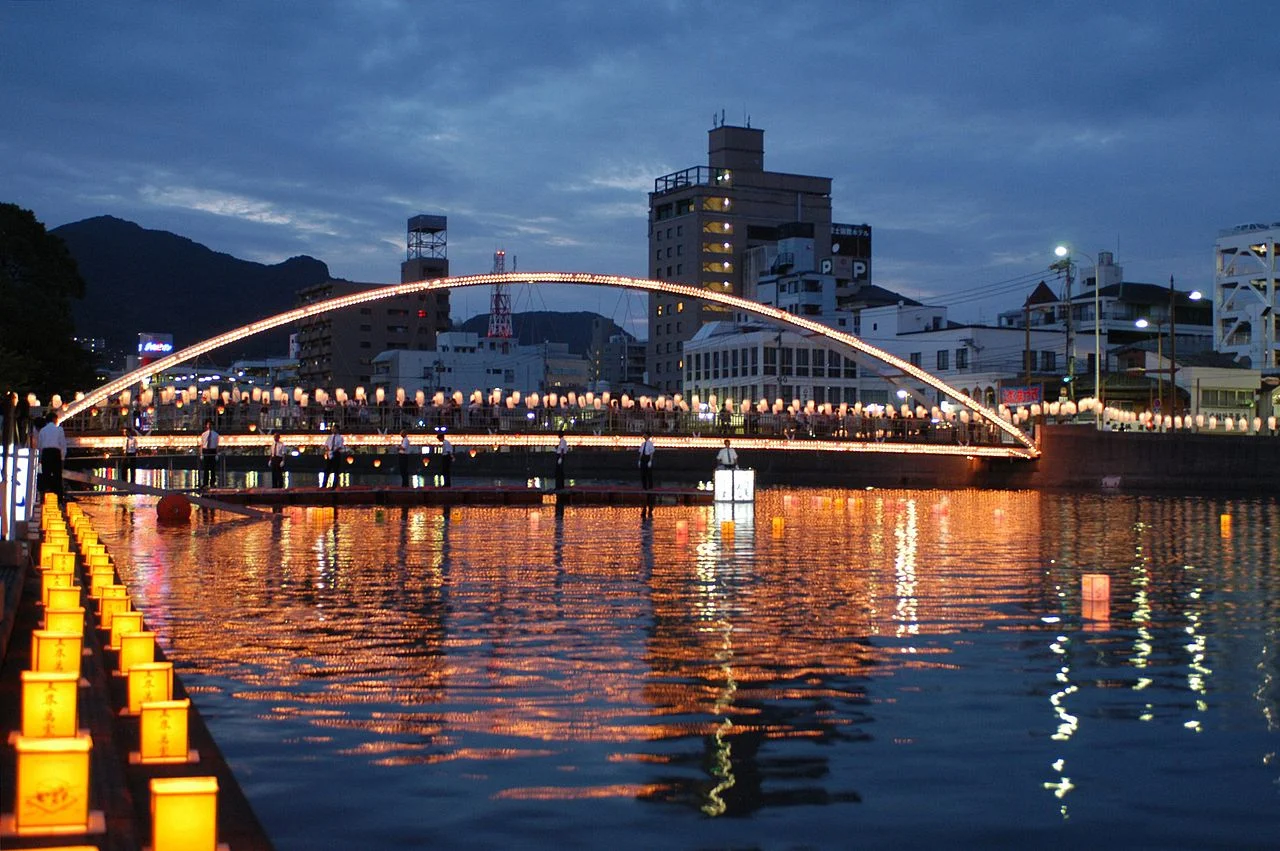 Lanterns being placed in the Sasebo River in Japan during the Obon (or “Bon”) Festival. Image from Wikimedia Commons.