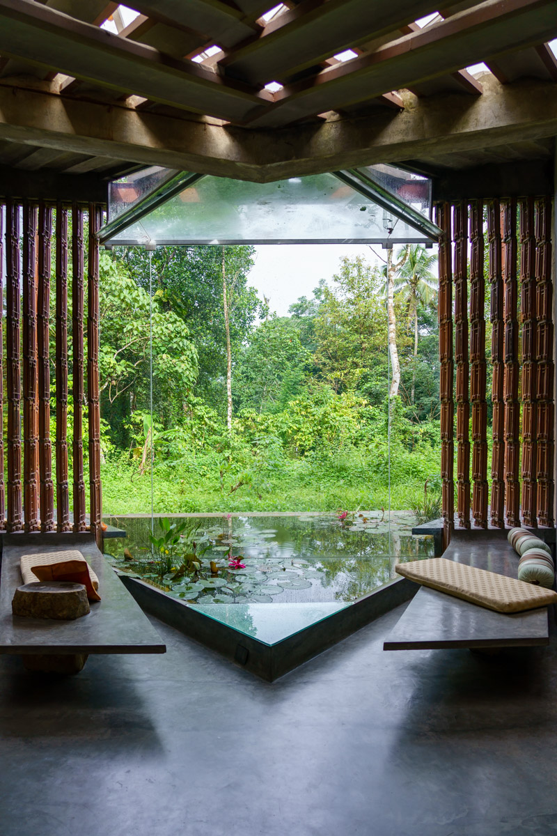 A pond with a fixed glass window right behind, entwine the interior with the exterior. While the window ensures a visual connect with the outside, the pond gives a feel of nature ushered inside.