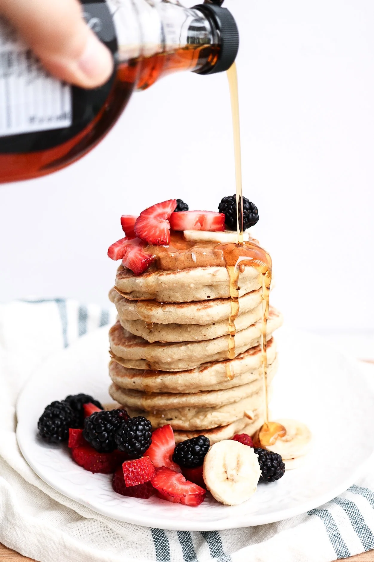 Top with fruit + syrup + nut butter for the ultimate stack!