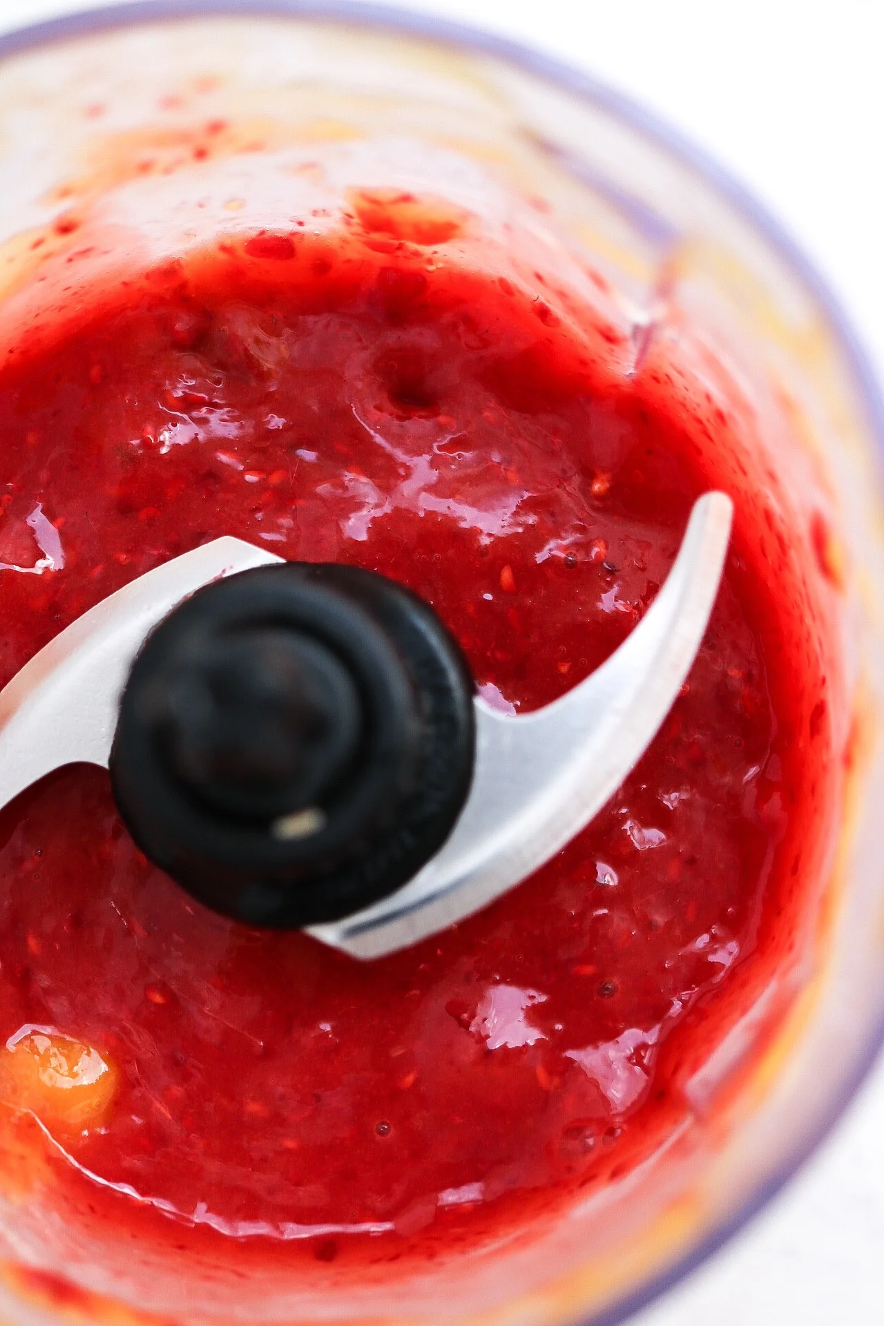 Blend together the mango + raspberries first, before adding in the rest!
