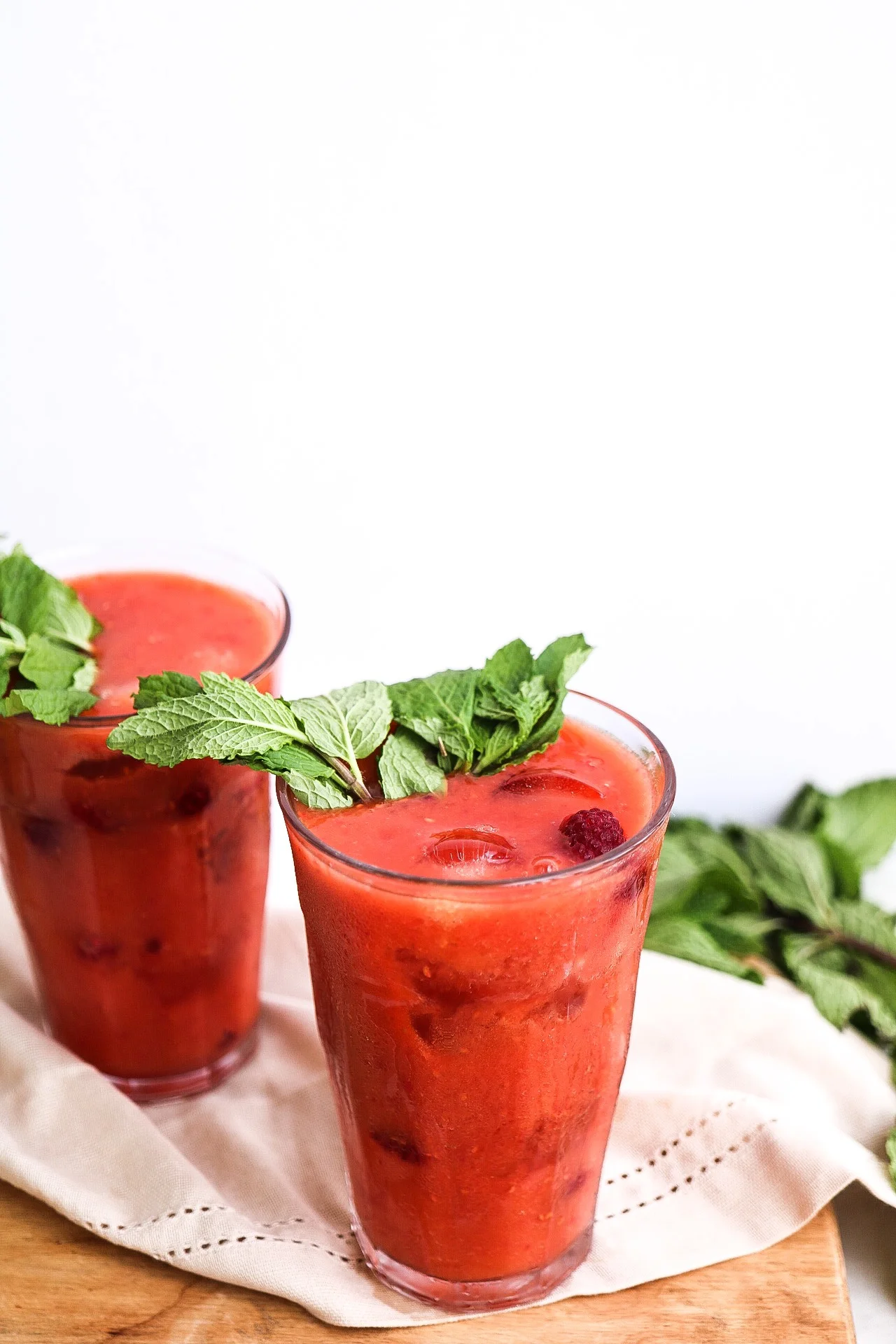 I like to throw in some frozen raspberries into the cocktail as well, just because it’s super pretty and at the bottom you can spoon them out with the drink :)