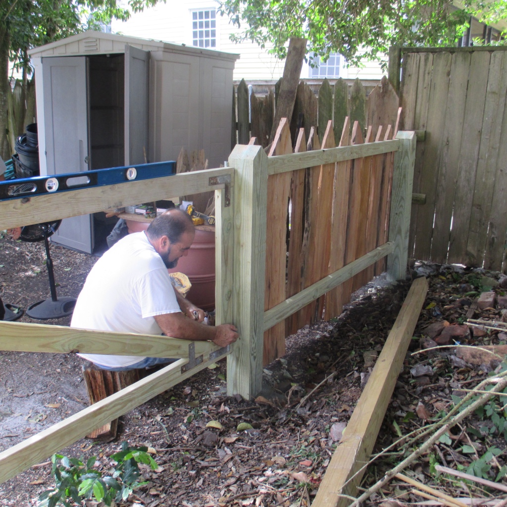 Duane Broussard building the pieux fence