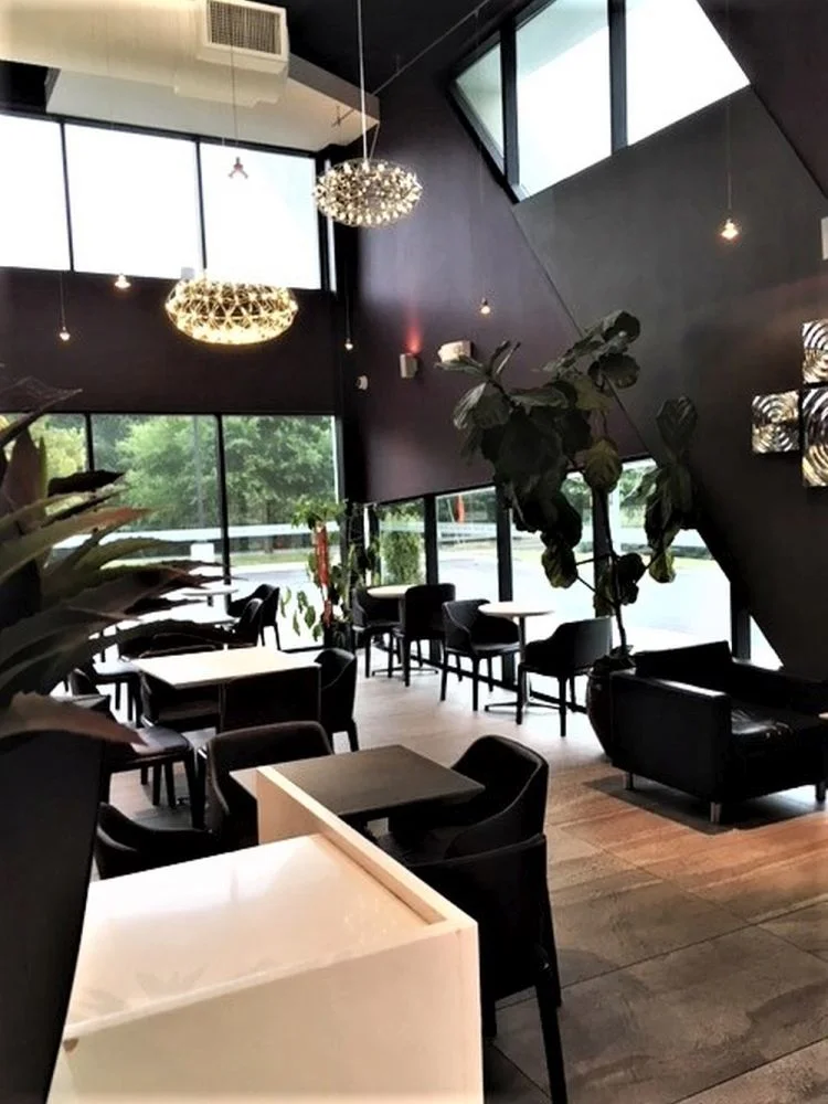 Fresh modern color palette with sleek furniture and lighting at Sweet Hut Bakery in Marietta