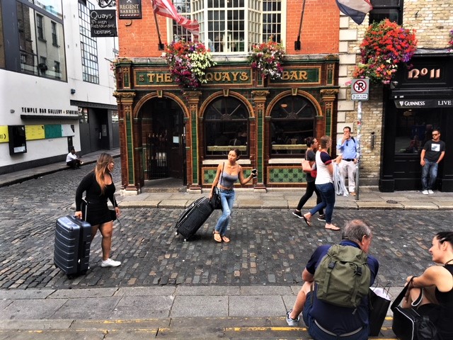 Tourists outside The Quays Bar
