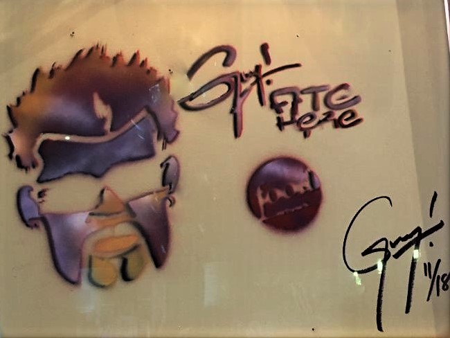 Guy Fieri signed and dated on the wall